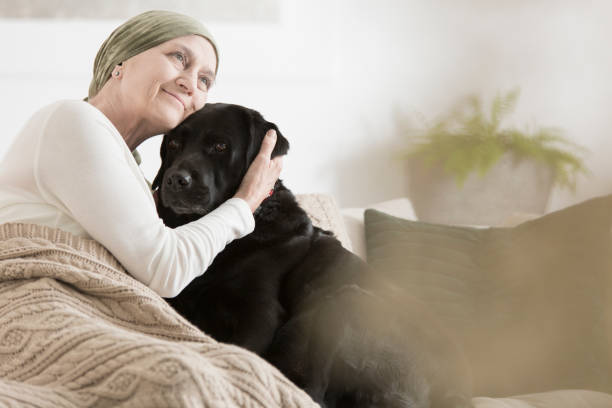 Woman sick hugging her pet dog affectionately